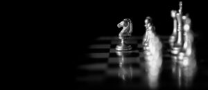 Chess pieces on a board illustrating strategic business insights and revenue vision.