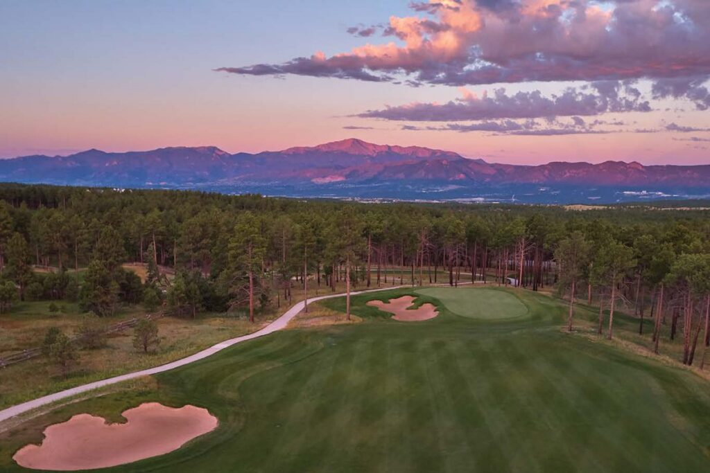 Sunset over the Flying Horse golf course with Pikes Peak behind
